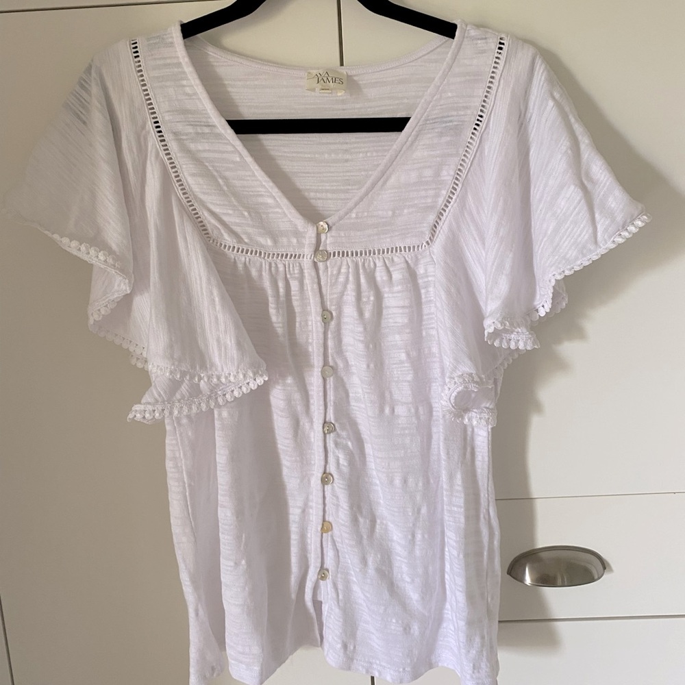 Ava James S white top with bat wing sleeves